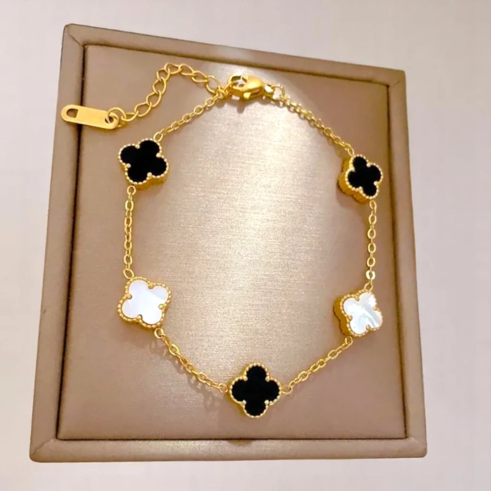 Bracelet on soft fabric box with a light toned background.