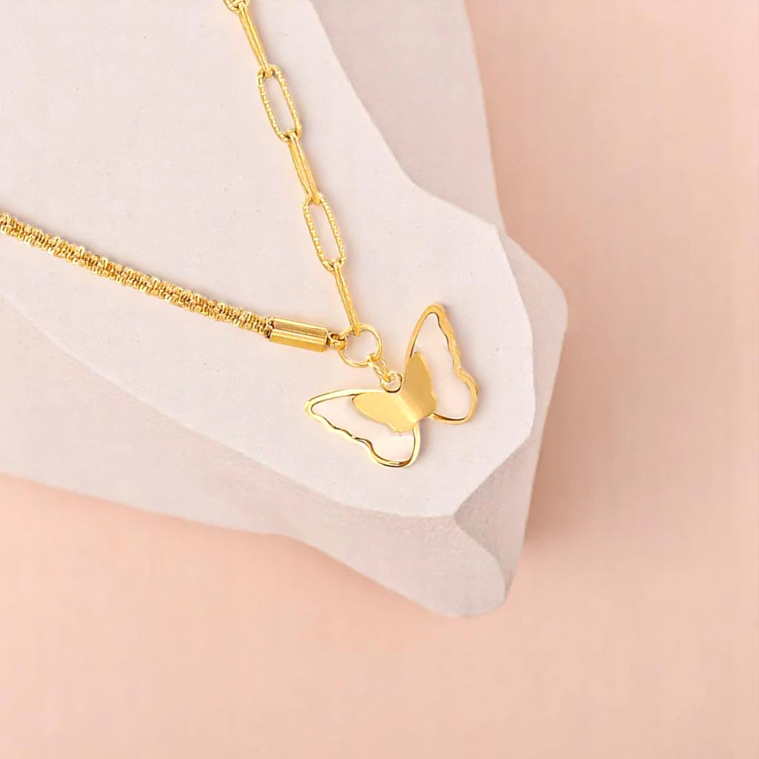 Bracelet zoom-in shot displayed on an uneven stone on a light-toned background.