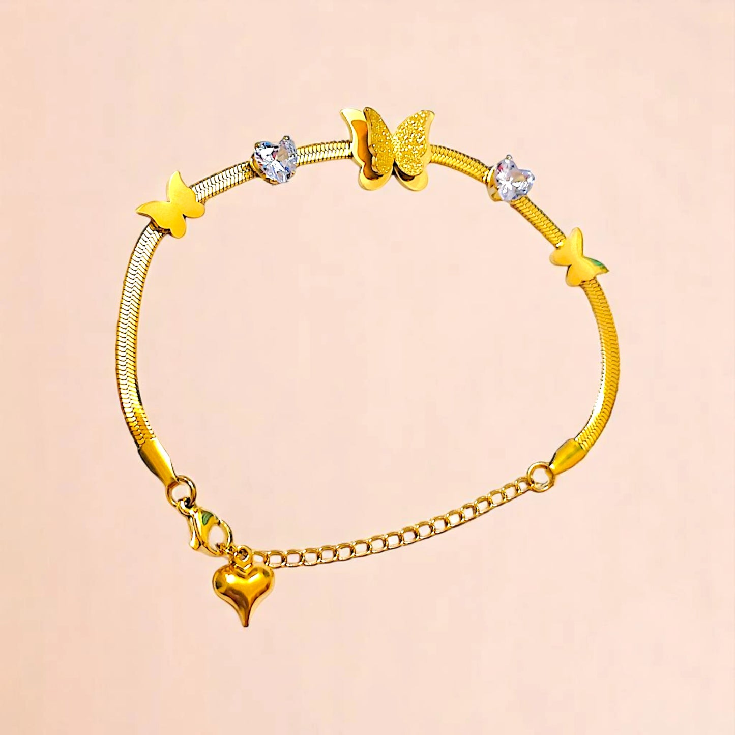 Bracelet on a color gradient of peach tones background.