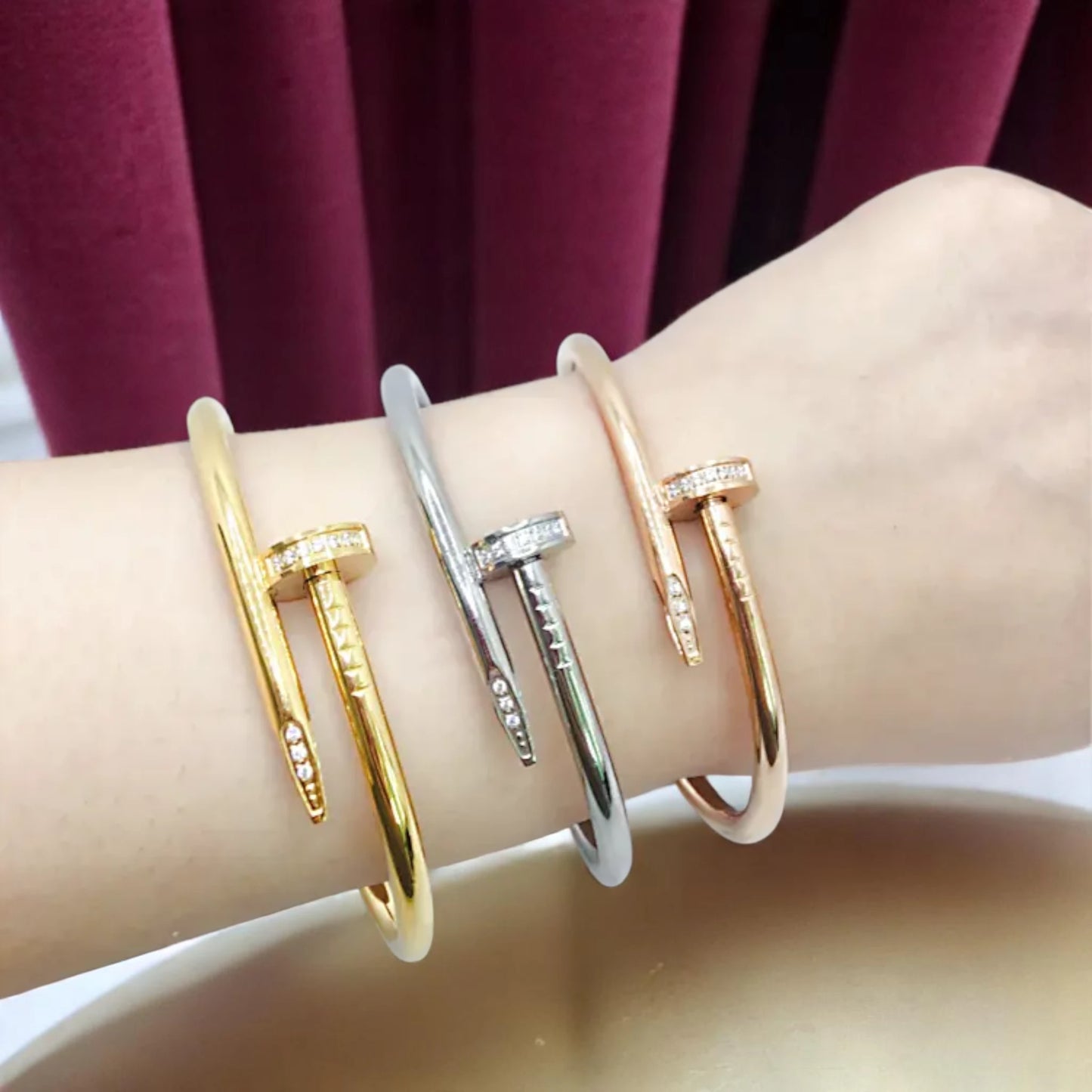 Gold, Silver and Rose Gold Bracelets worn by a model