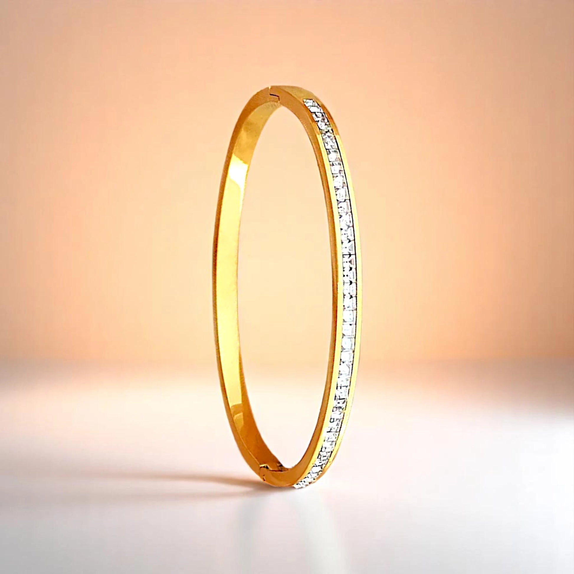 Bracelet on a color gradient of peach tones background.