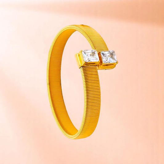 Bracelet on a color gradient of peach tones background.