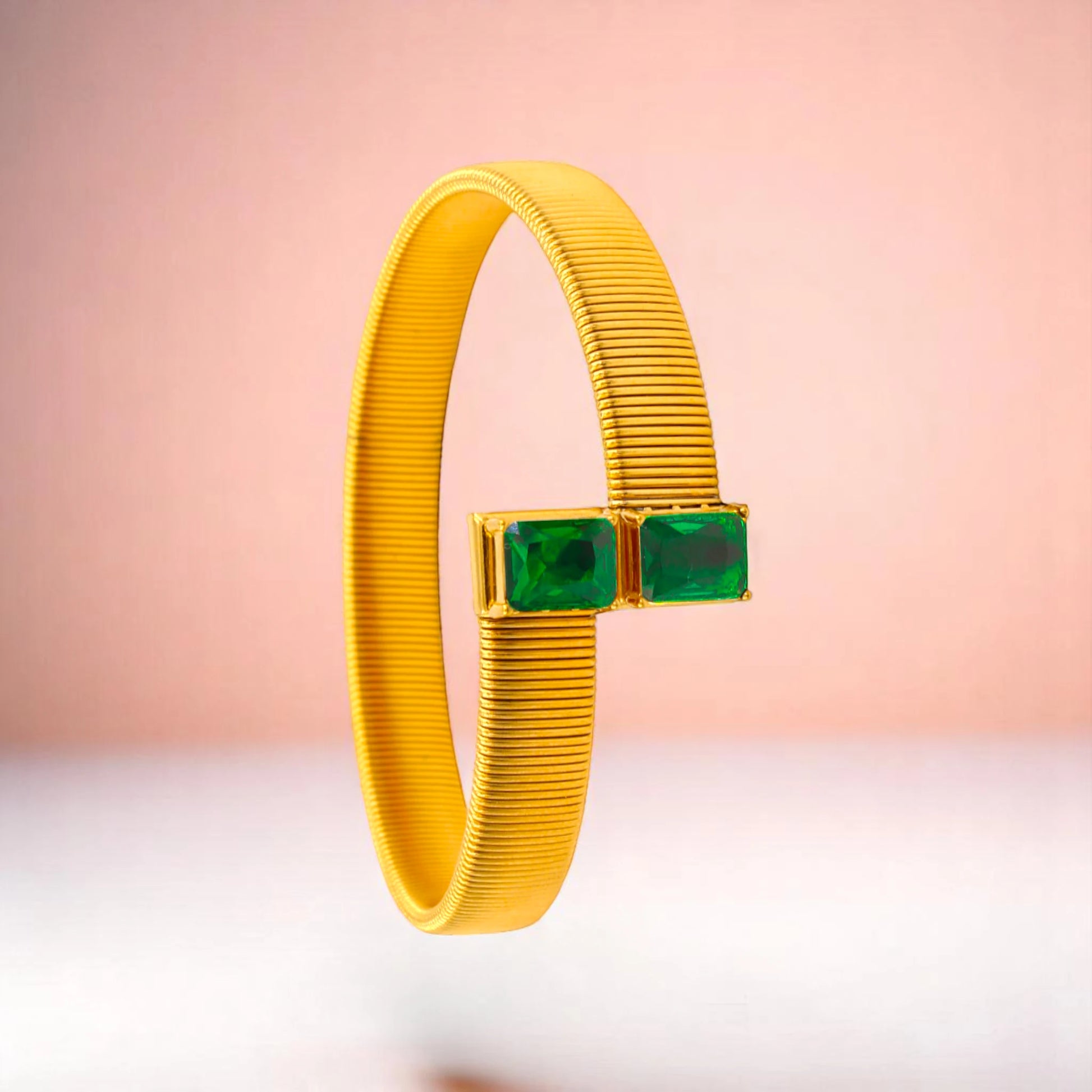 Bracelet on a color gradient of peach tones background.