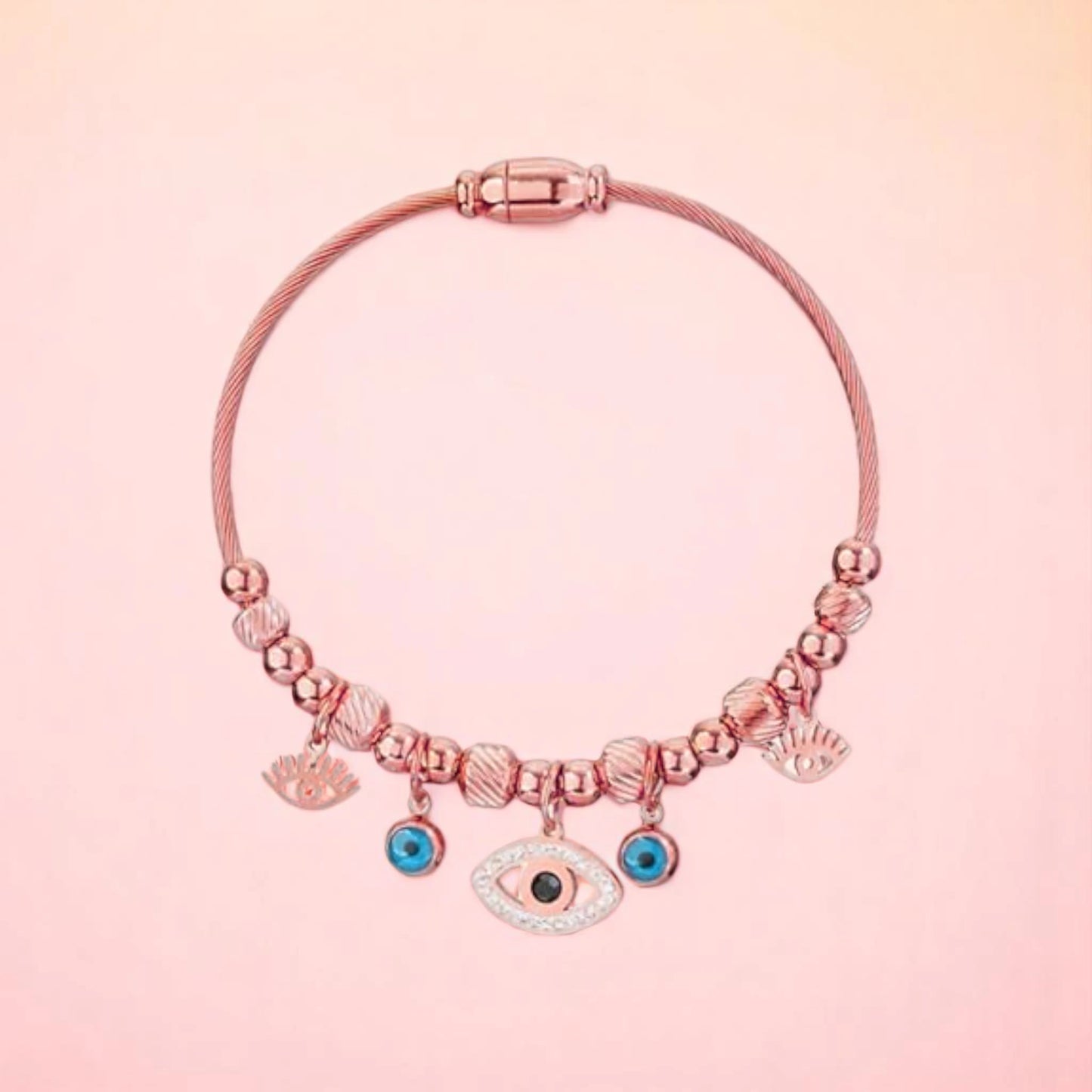 Bracelet on a color gradient of peach tones background.