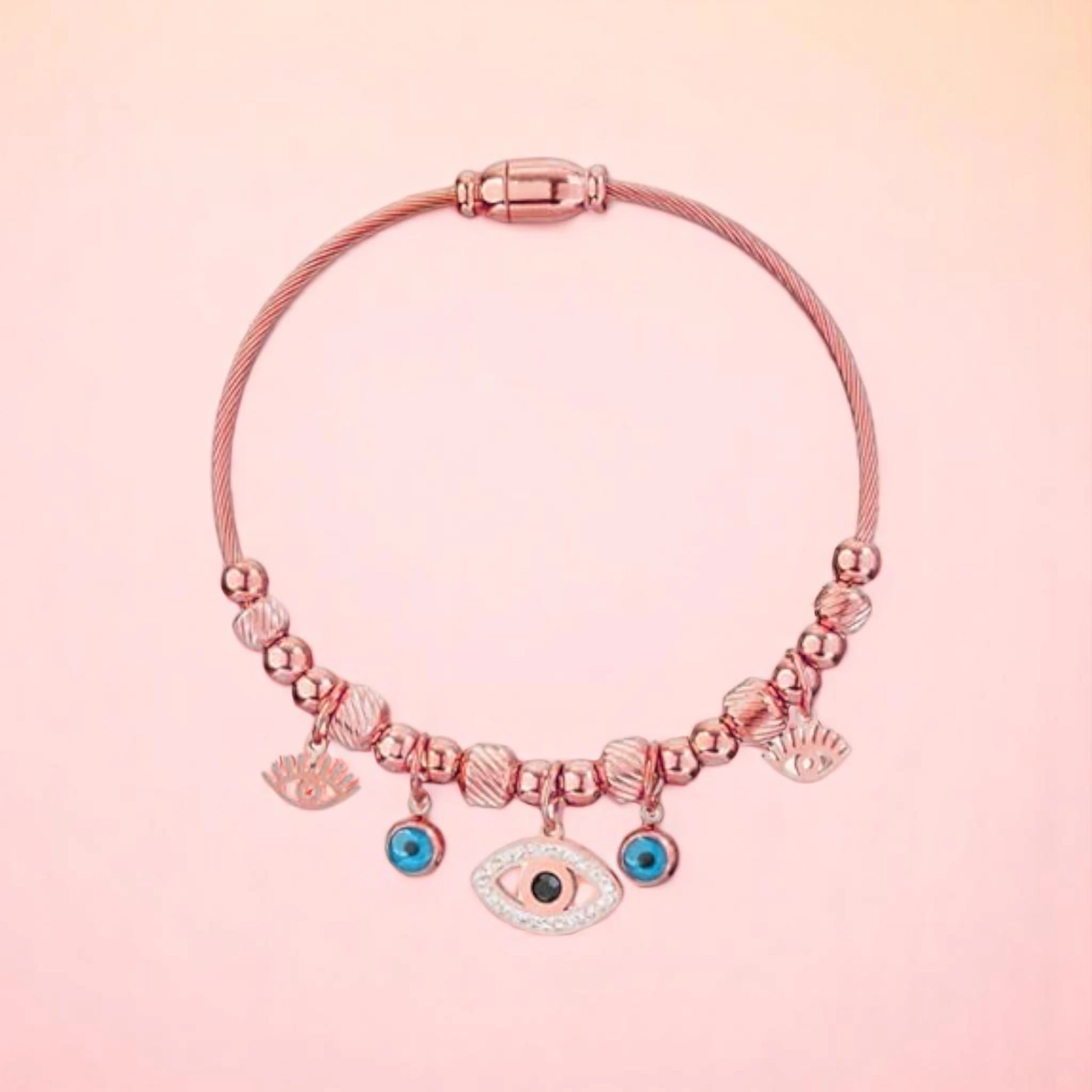 Bracelet on a color gradient of peach tones background.