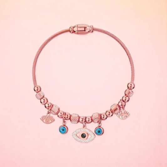 Bracelet on a color gradient of peach tones background.