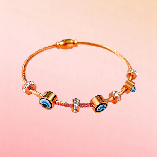 Bracelet on a color gradient of peach tones background.