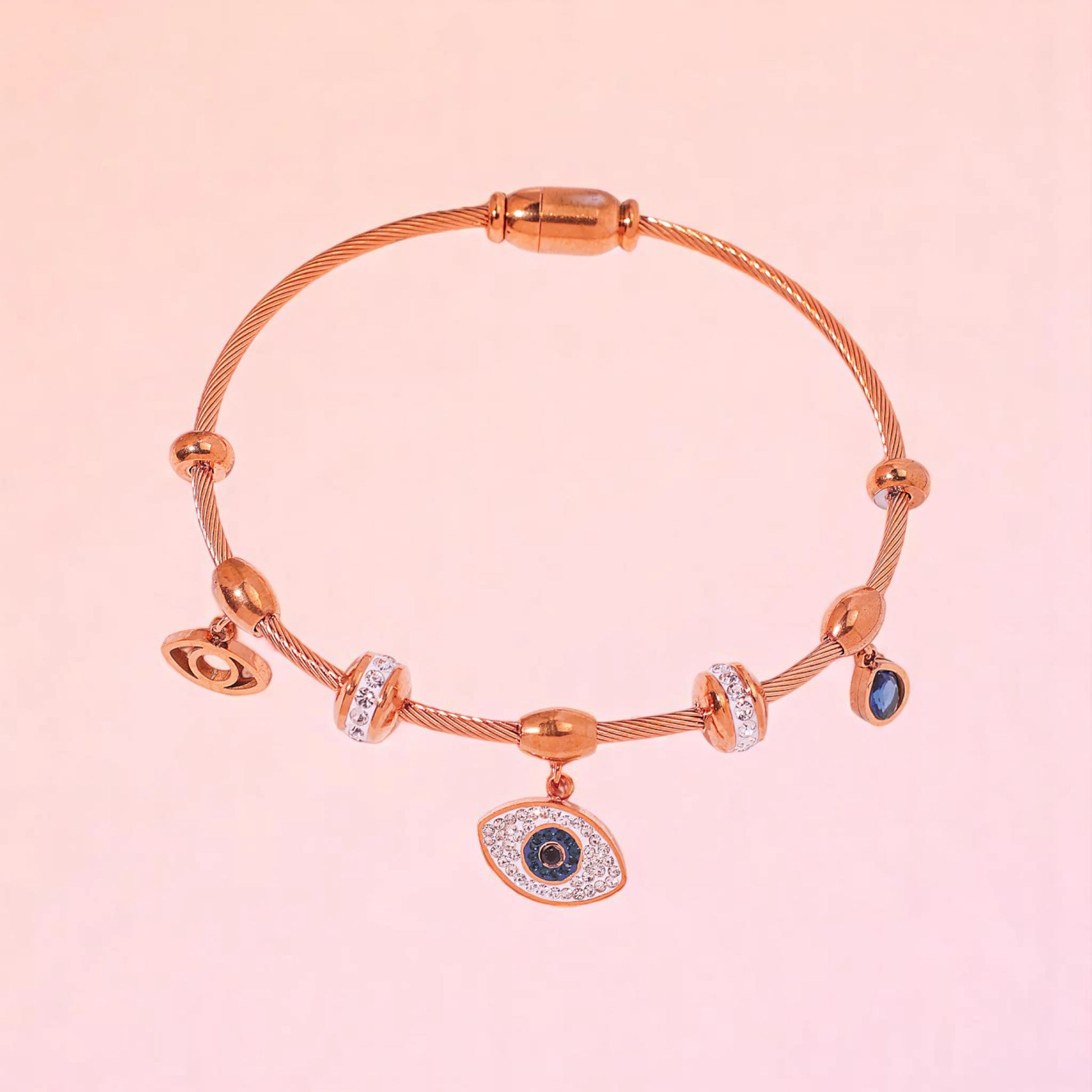 Bracelet on a color gradient of peach tones background.