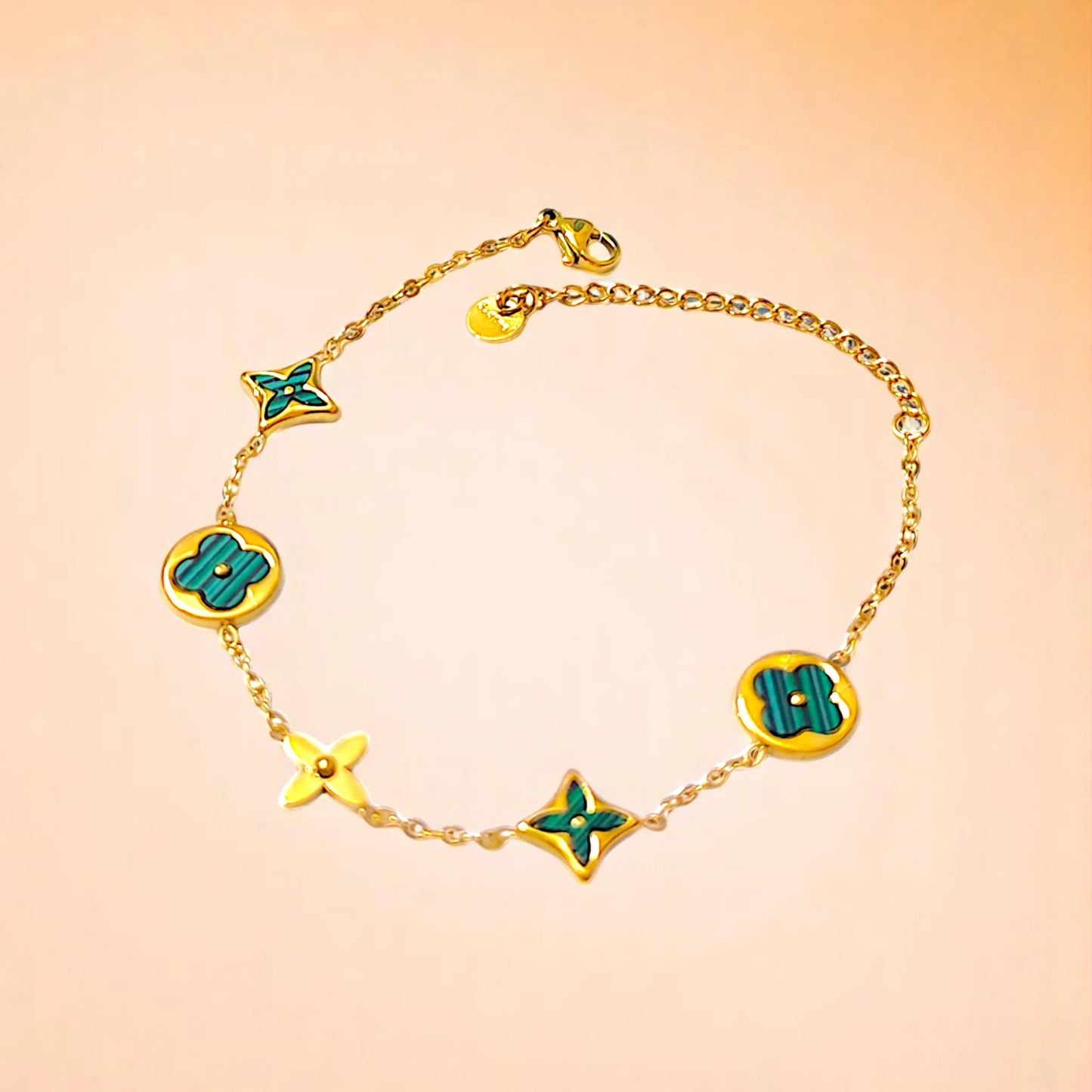 Bracelet on a color gradient of peach tones background.