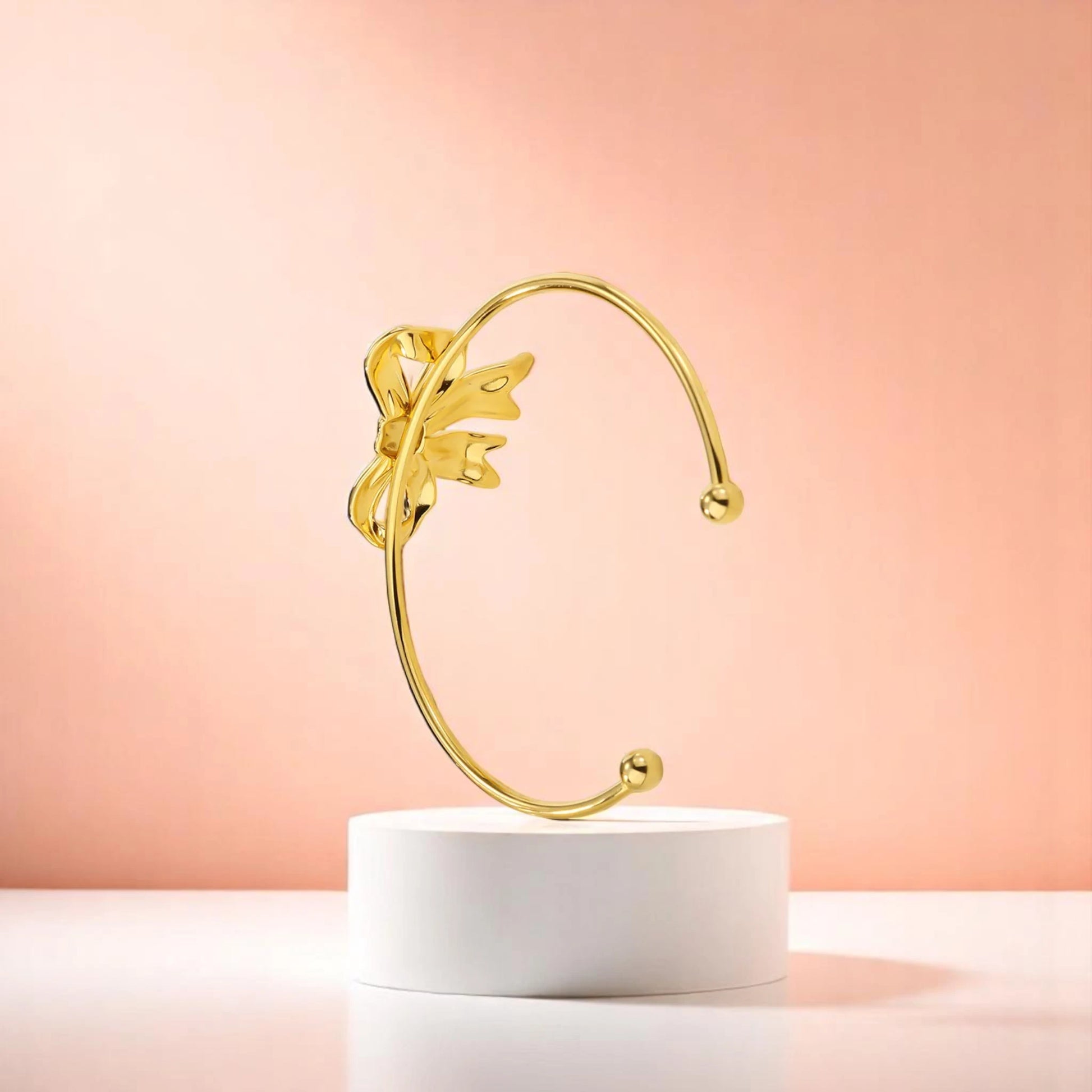 Bracelet on geometric prop with peach color gradient in the background.