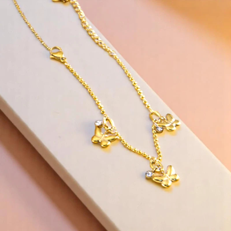 Bracelet on geometric prop with peach color gradient in the background.