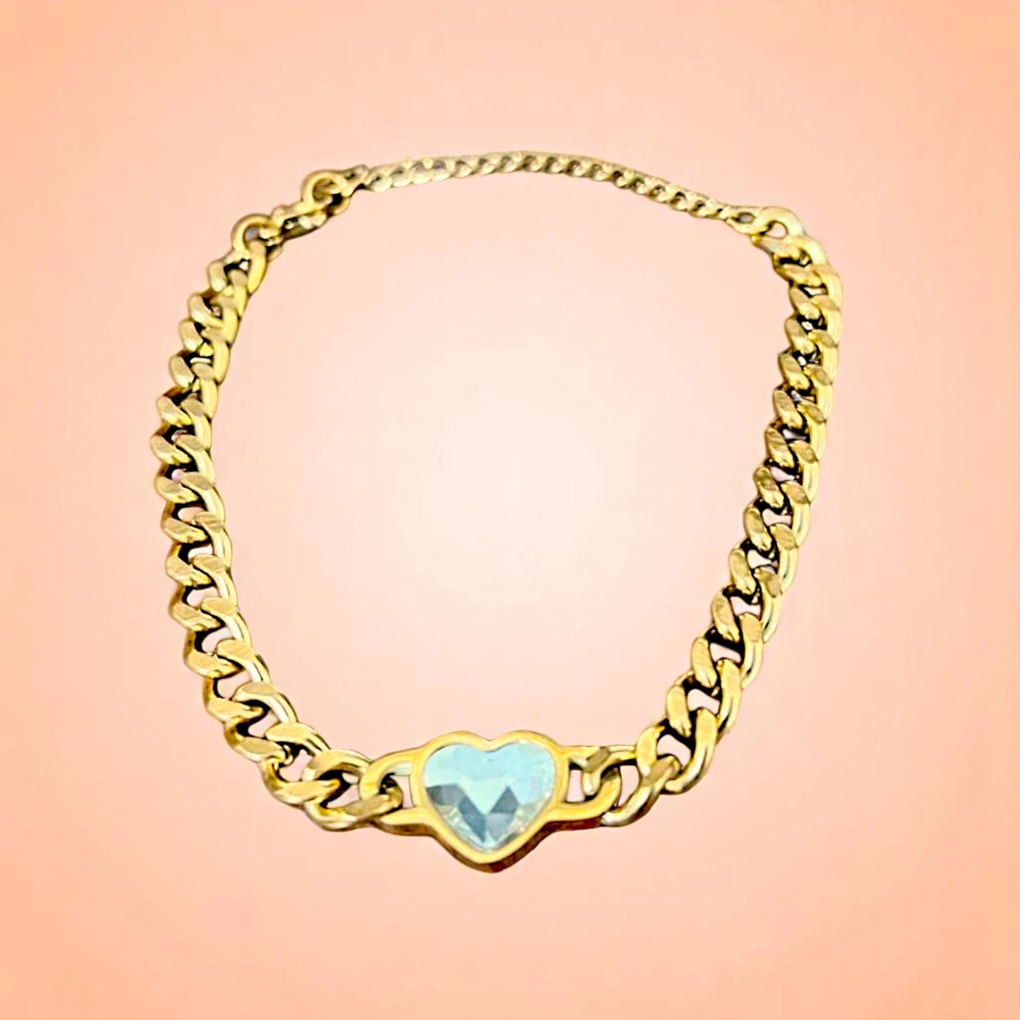 Bracelet on a color gradient of peach tones background.