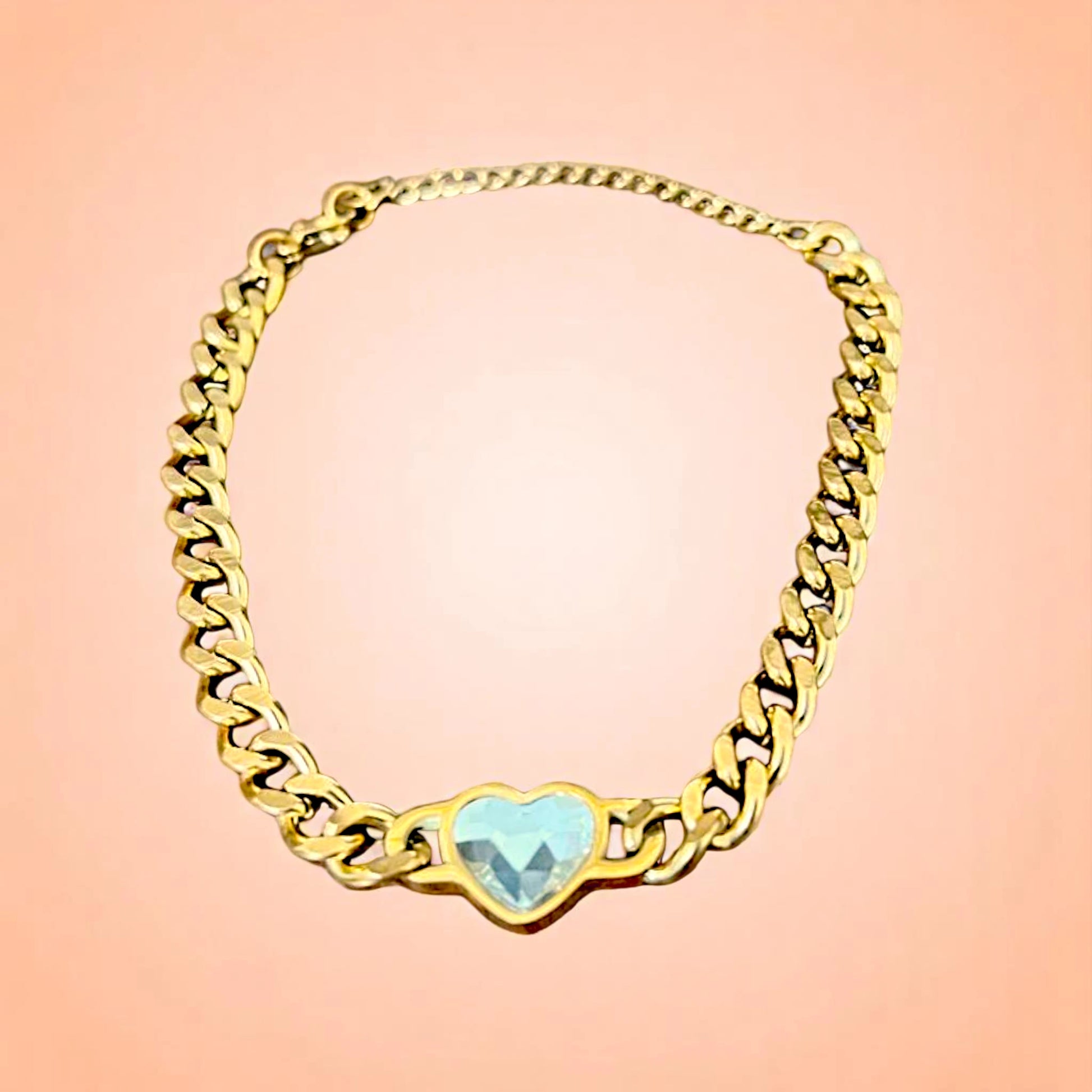 Bracelet on a color gradient of peach tones background.