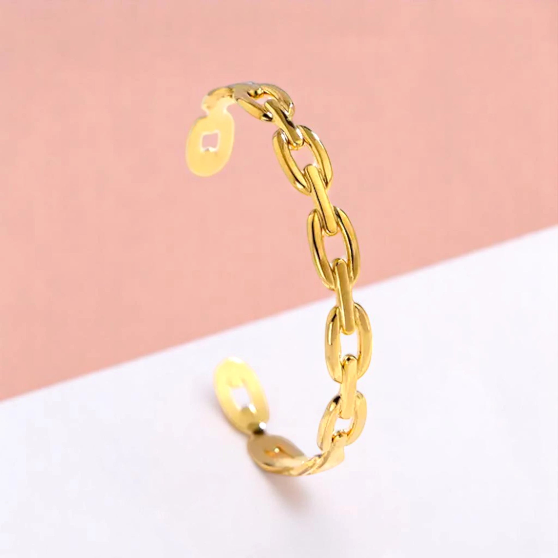 Bracelet on a color gradient of peach tones background.