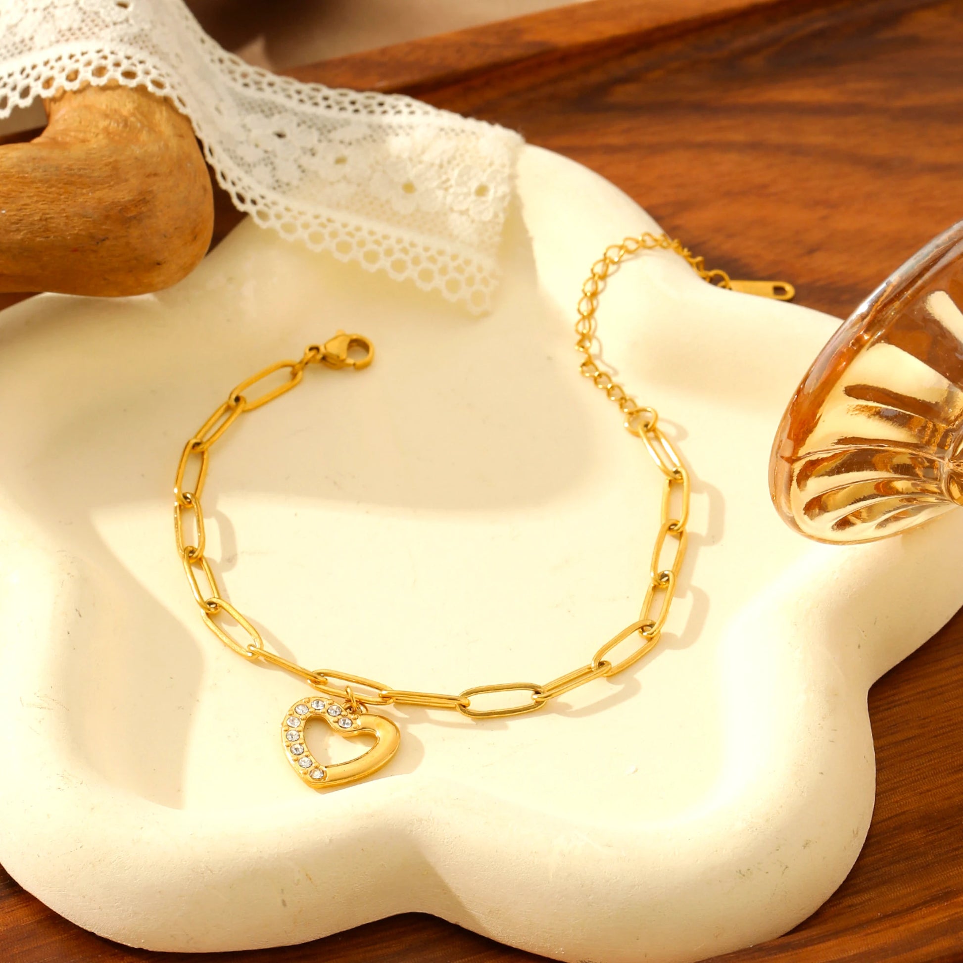 Bracelet resting on a decorative white prop with lace.