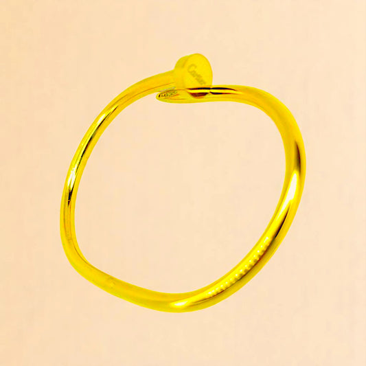 Bracelet on a color gradient of peach tones background.