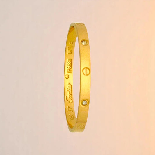 Bracelet on a color gradient of peach tones background.