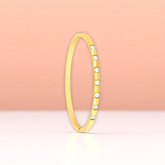 Bracelet set against a soft gradient background.