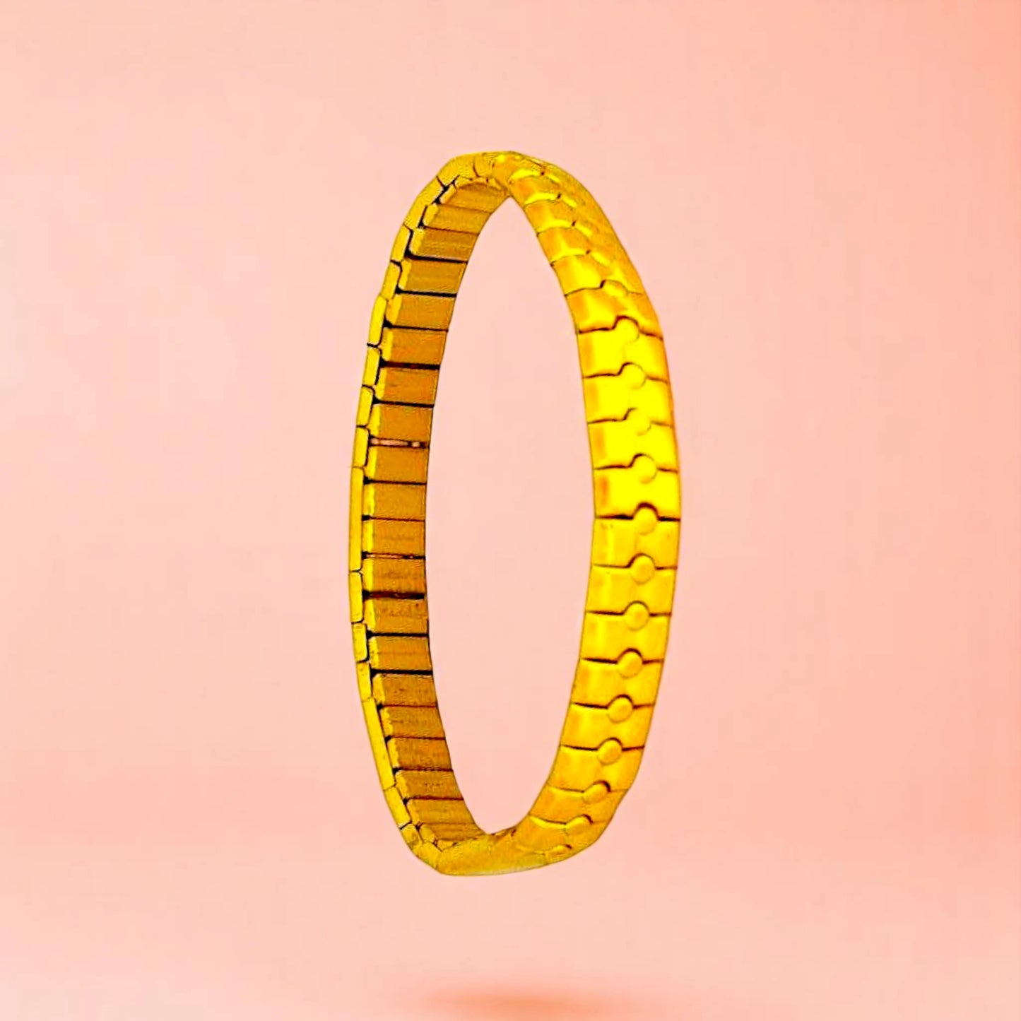 Bracelet on a color gradient of peach tones background.