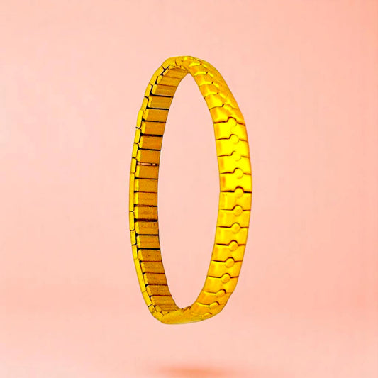 Bracelet on a color gradient of peach tones background.