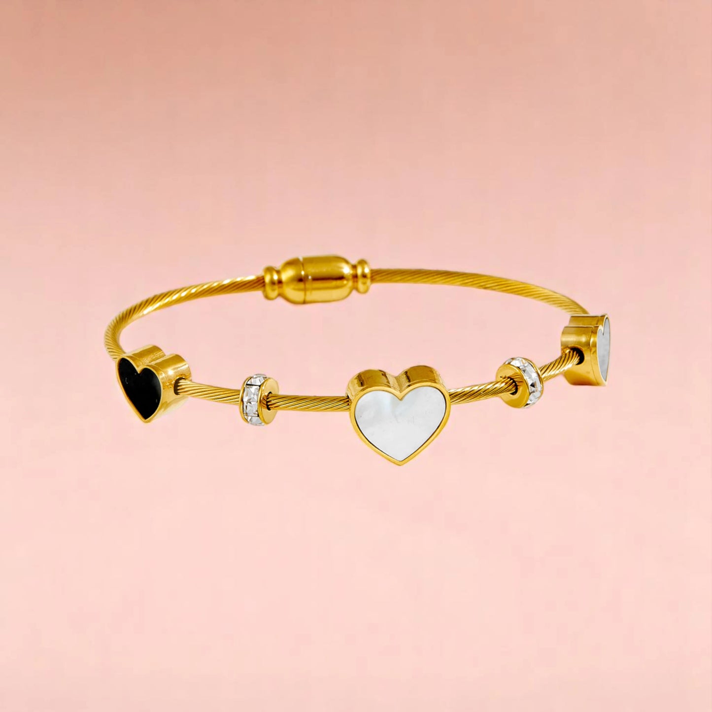 Bracelet on a color gradient of peach tones background.