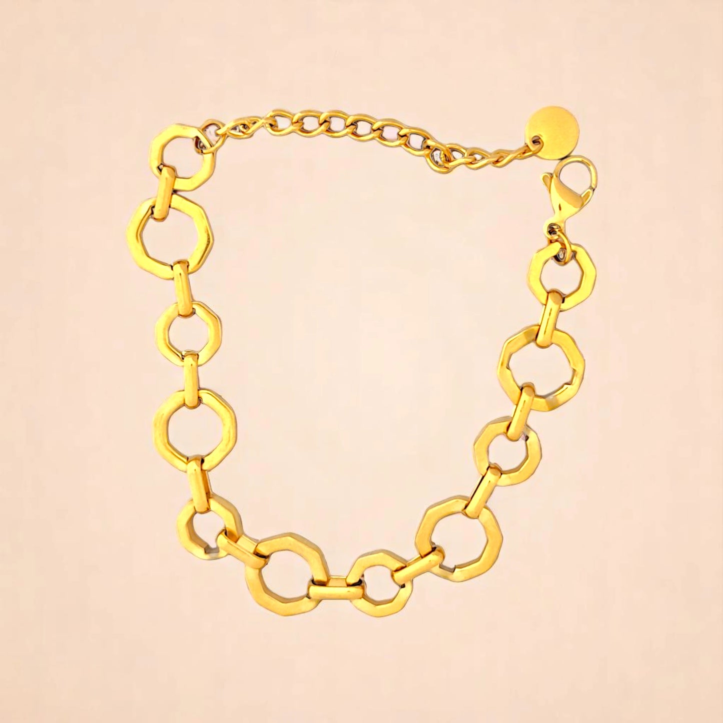 Bracelet on a color gradient of peach tones background.