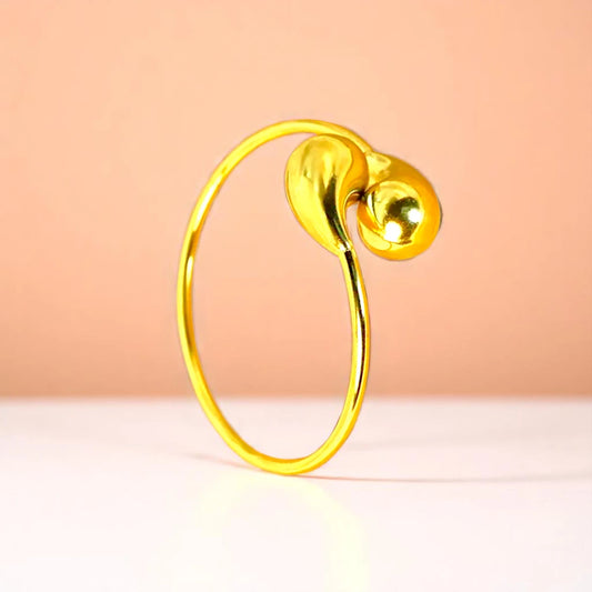 Bracelet on a color gradient of peach tones background.