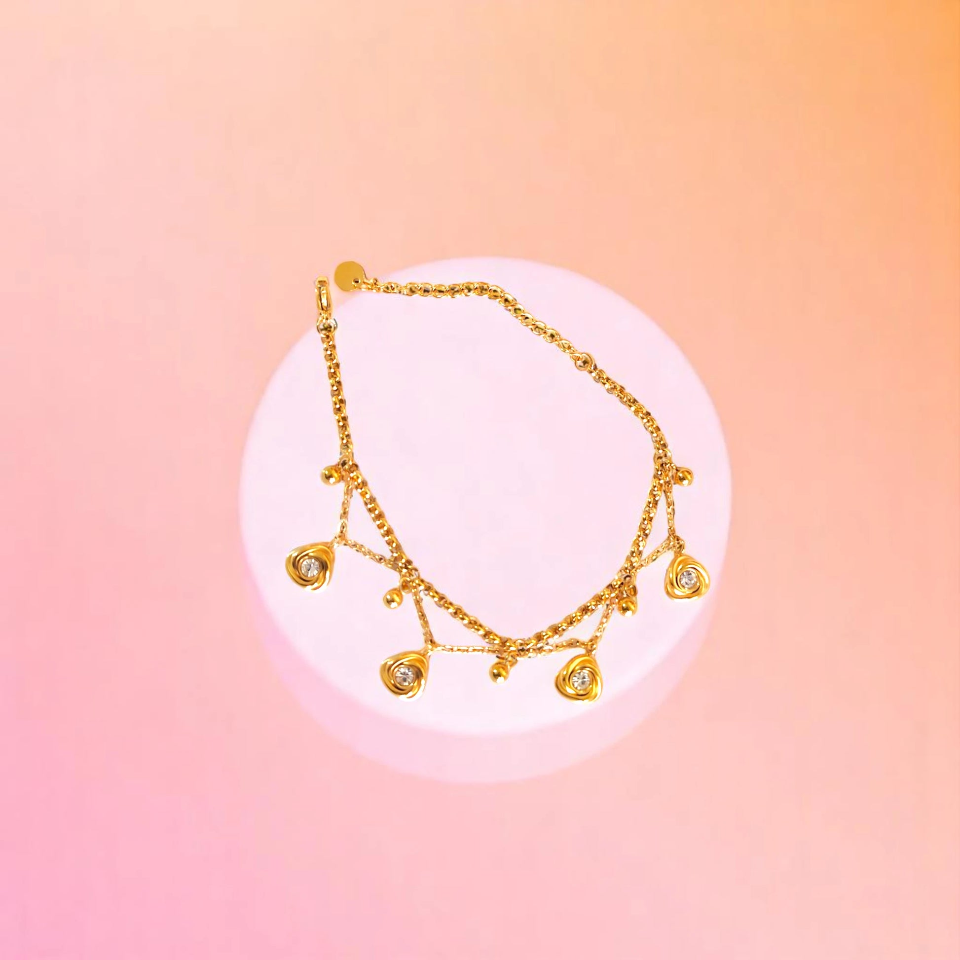 Bracelet on geometric prop with peach color gradient in the background.