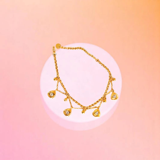 Bracelet on geometric prop with peach color gradient in the background.