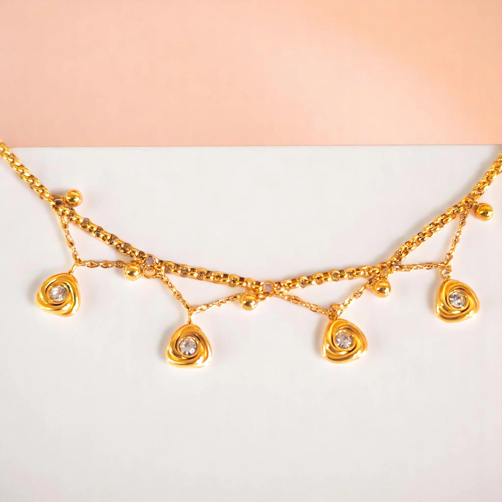 Bracelet on geometric prop with peach color gradient in the background.