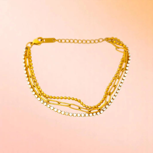 Bracelet on a color gradient of peach tones background.