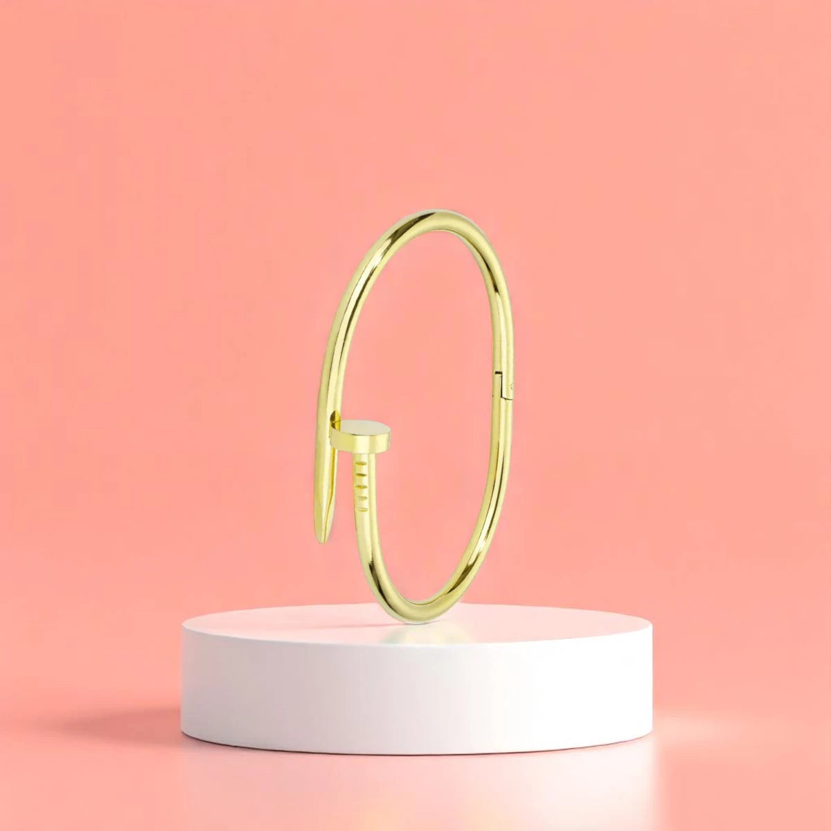 Bracelet displayed on a white pedestal against a soft peach background.