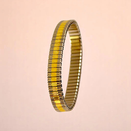 Bracelet on a color gradient of peach tones background.