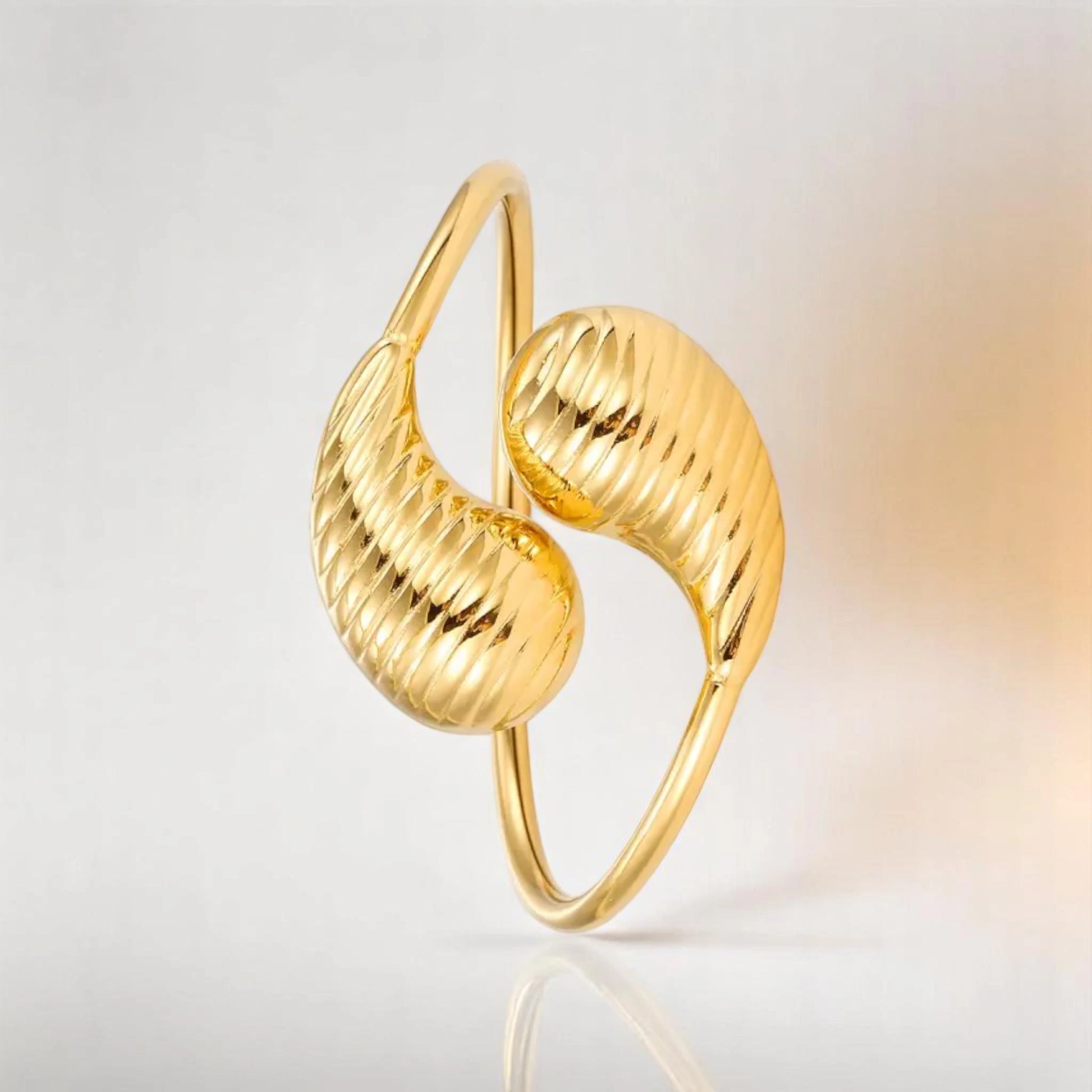 Bracelet on a color gradient of peach tones background.