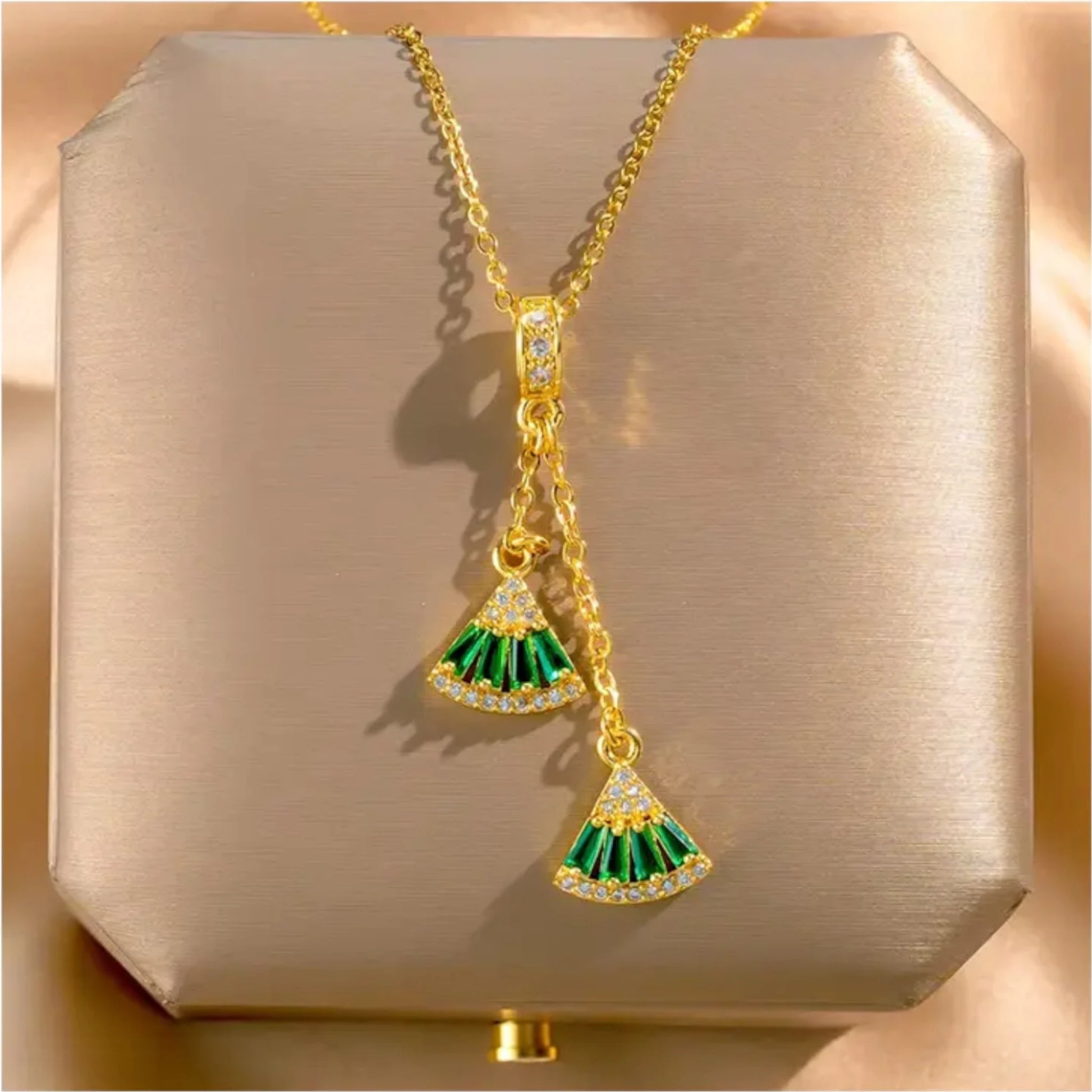 Necklace on a soft fabric box with a light-toned background.