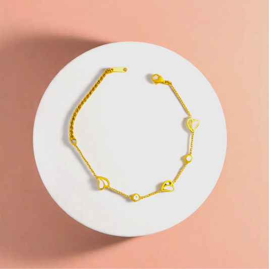 Bracelet on geometric prop with peach color gradient in the background.