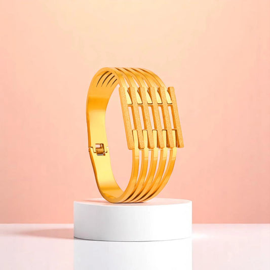 Bracelet on geometric prop with peach color gradient in the background.