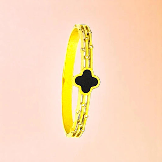 Bracelet on a color gradient of peach tones background.