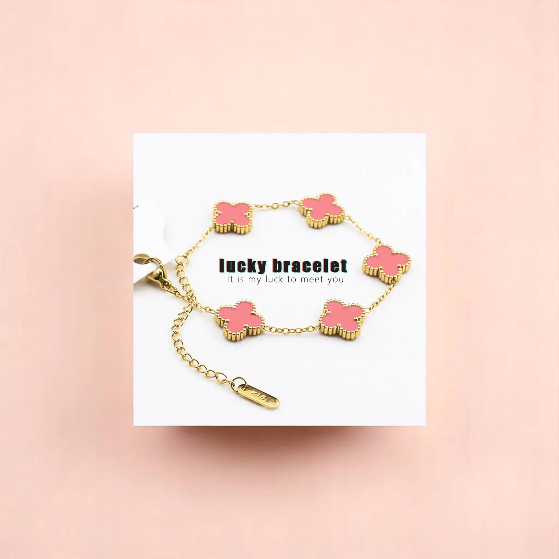 Bracelet on geometric prop with peach color gradient in the background.