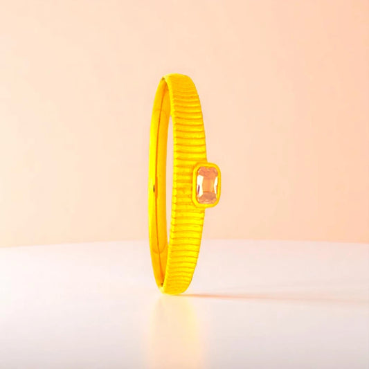 Bracelet set against a soft gradient background.