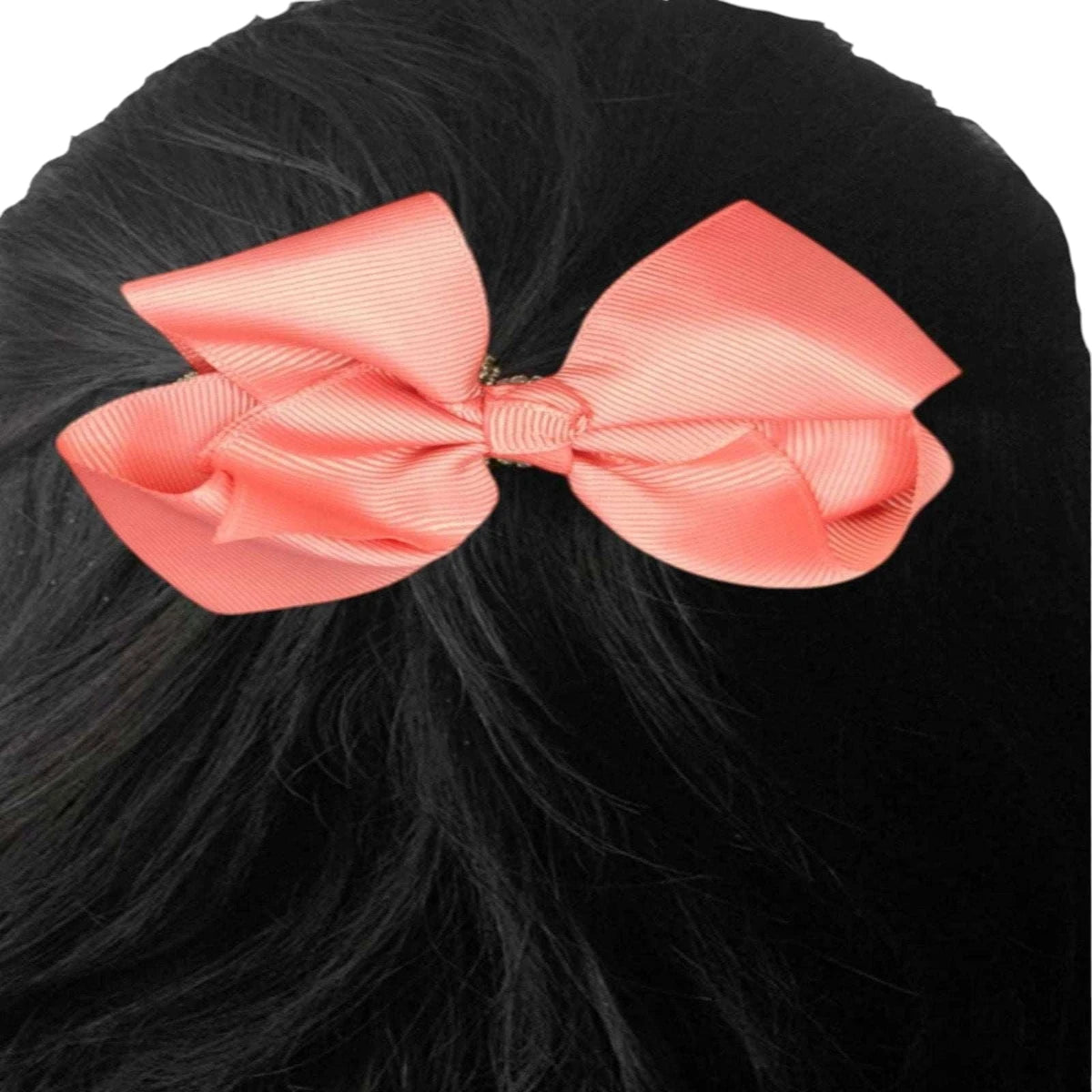 Large pink bow on black hair