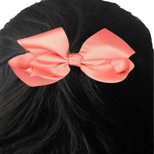 Large pink bow on black hair