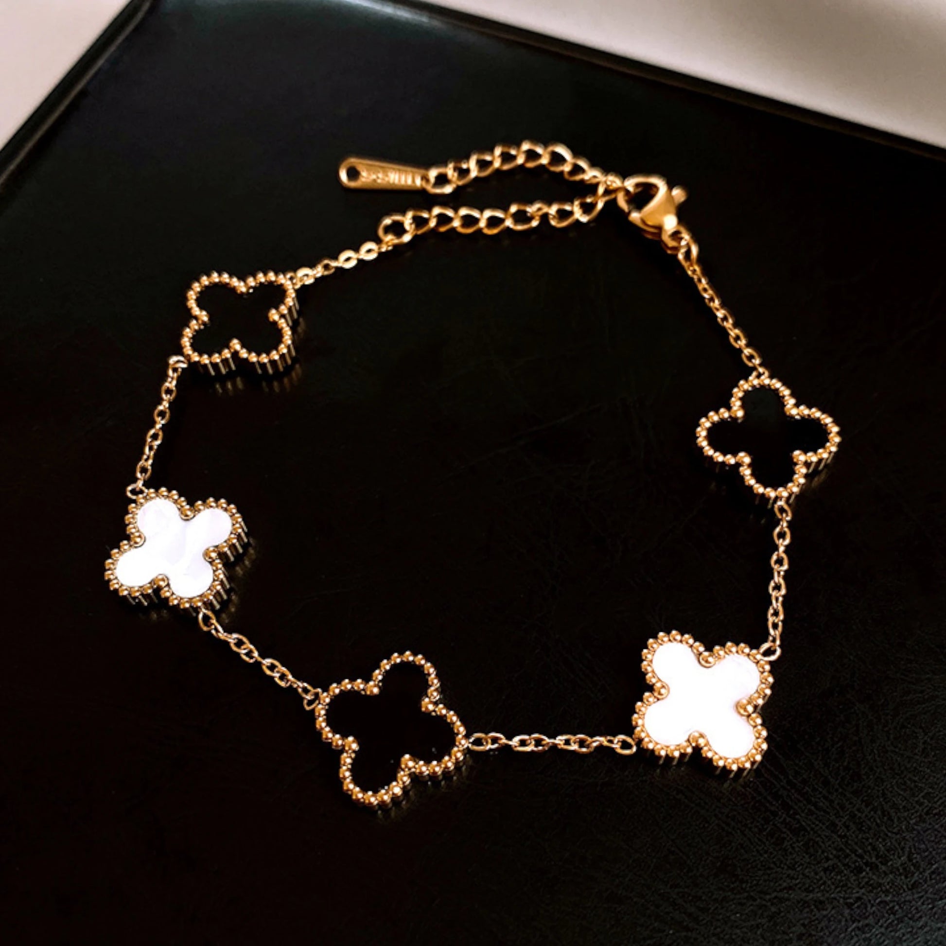 Bracelet on a soft fabric box with a light-toned background.