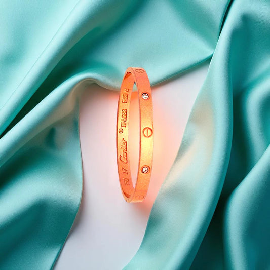 Bracelet set against a soft teal cloth background.