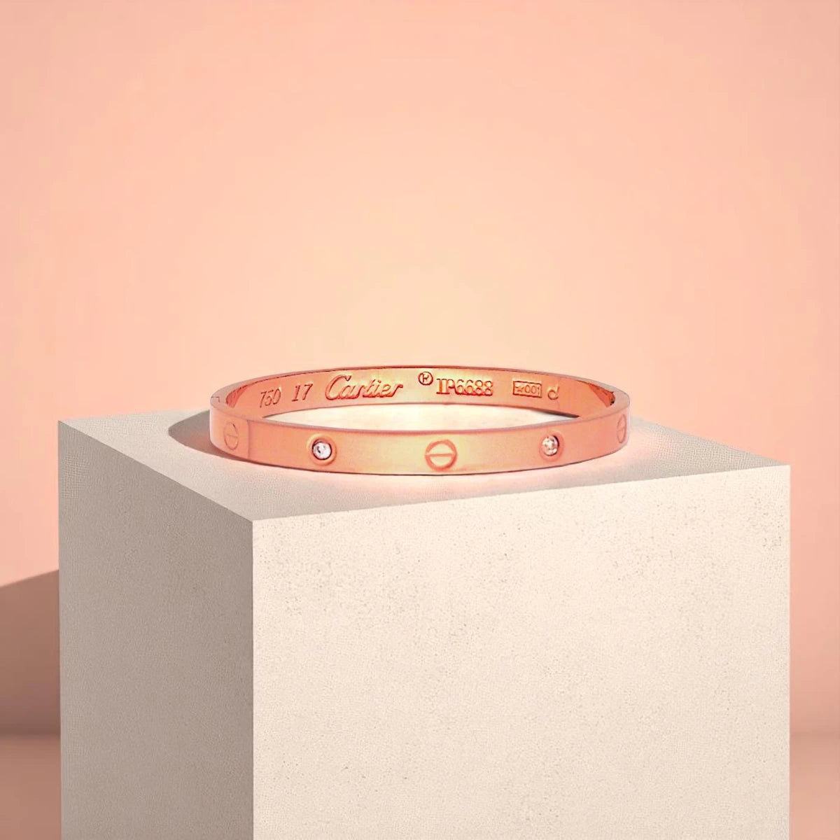 Bracelet displayed on a light-colored travertine stone slab with a peach-colored gradient in the background.