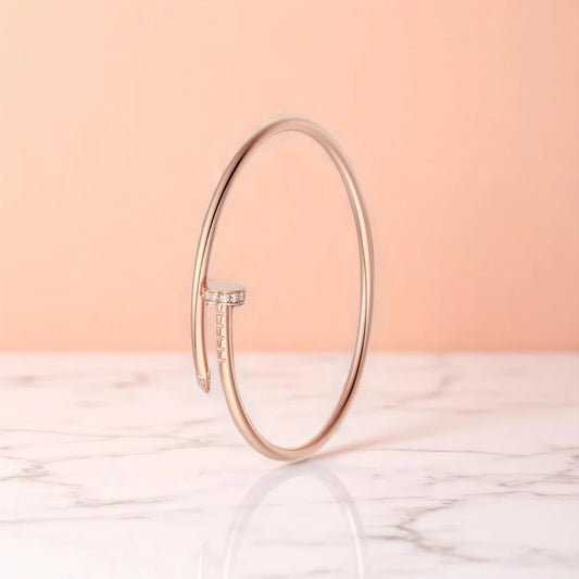 Bracelet set against a soft gradient background.