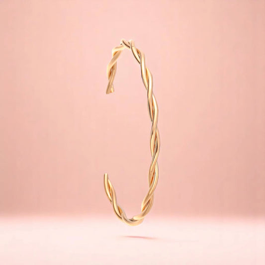 Bracelet on a color gradient of peach tones background.