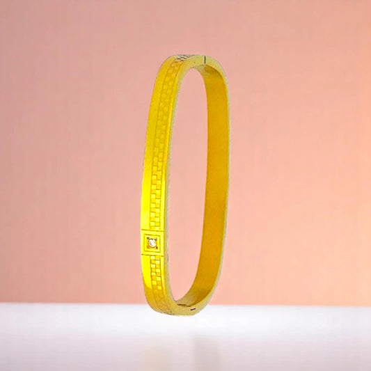 Bracelet on a color gradient of peach tones background.