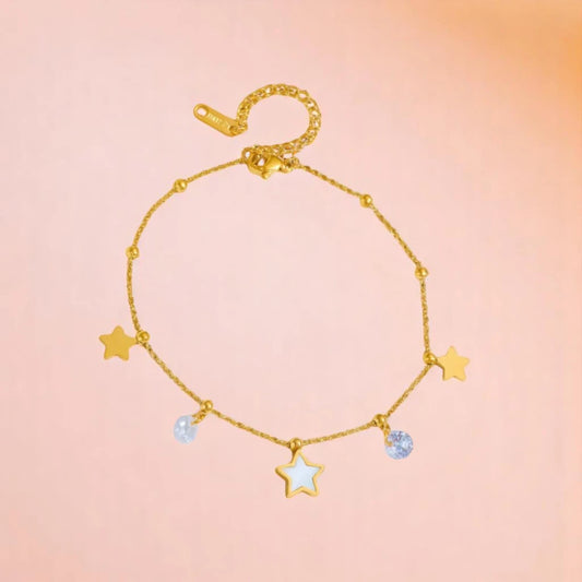 Anklet on a color gradient of peach tones background.