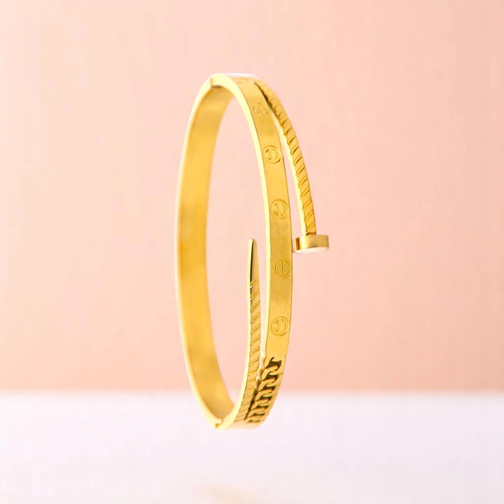 Bracelet on a color gradient of peach tones background.